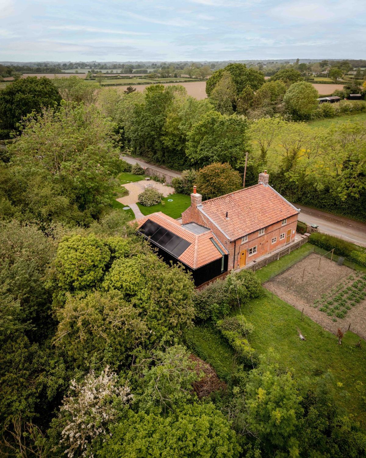Cambrills — the restored brick cottage and garden seen from above