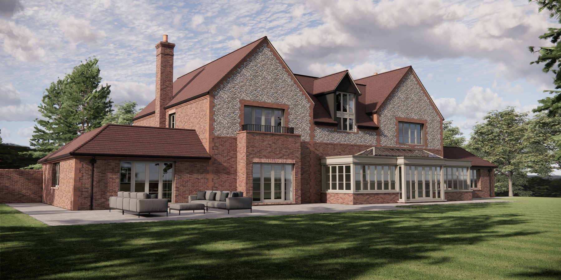 The rear of the house across the lawn, with its garden room and terrace