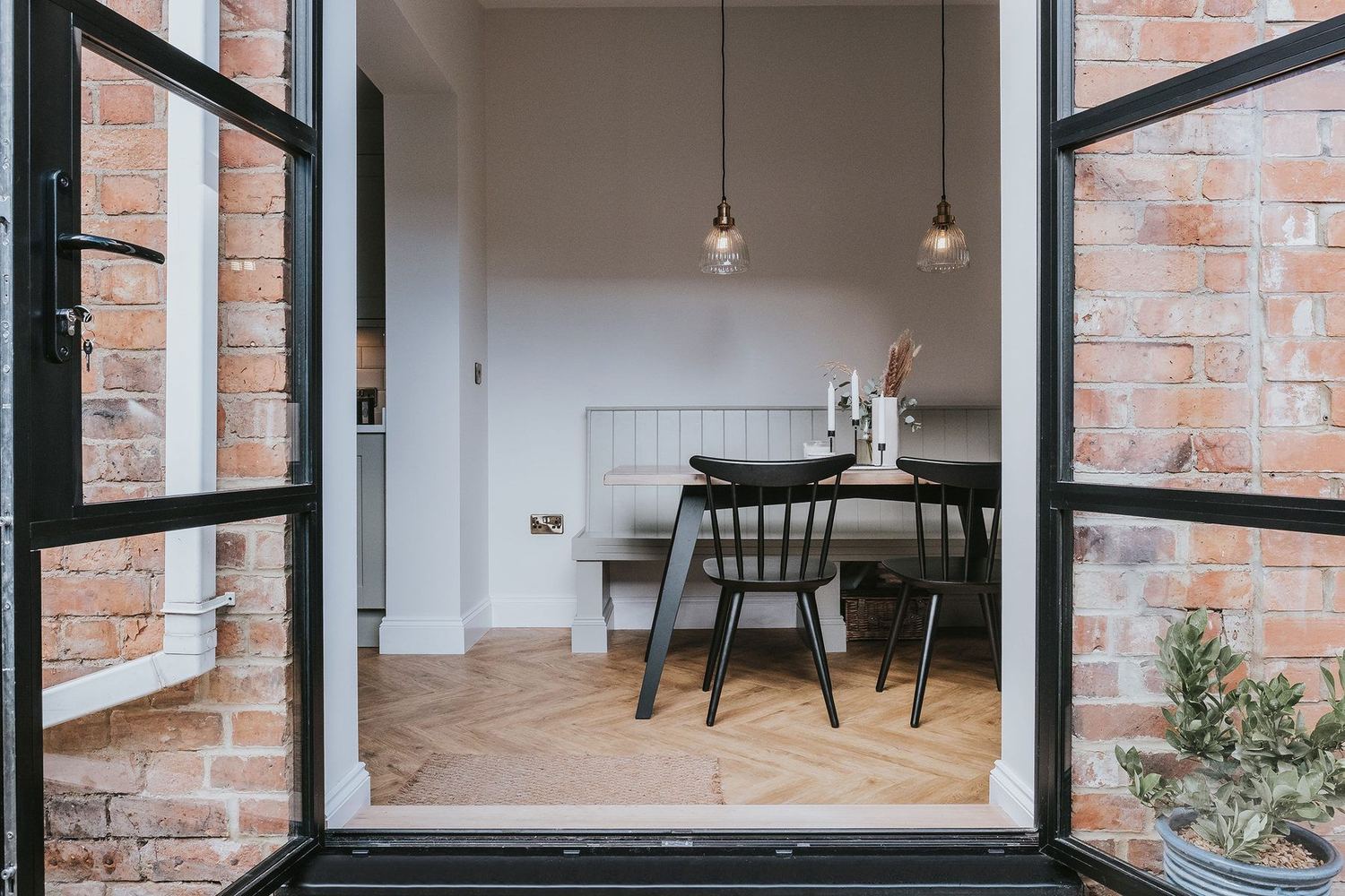 Crittall-style doors and exposed brick reveal