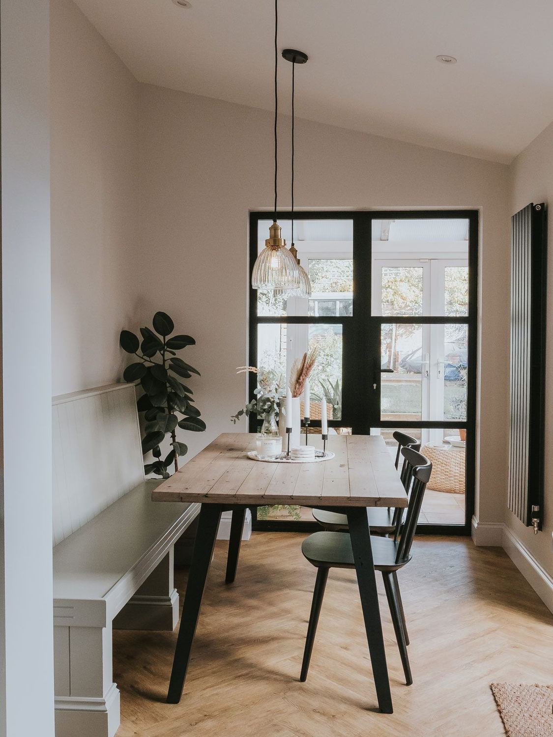 Dining nook beneath Crittall glazing