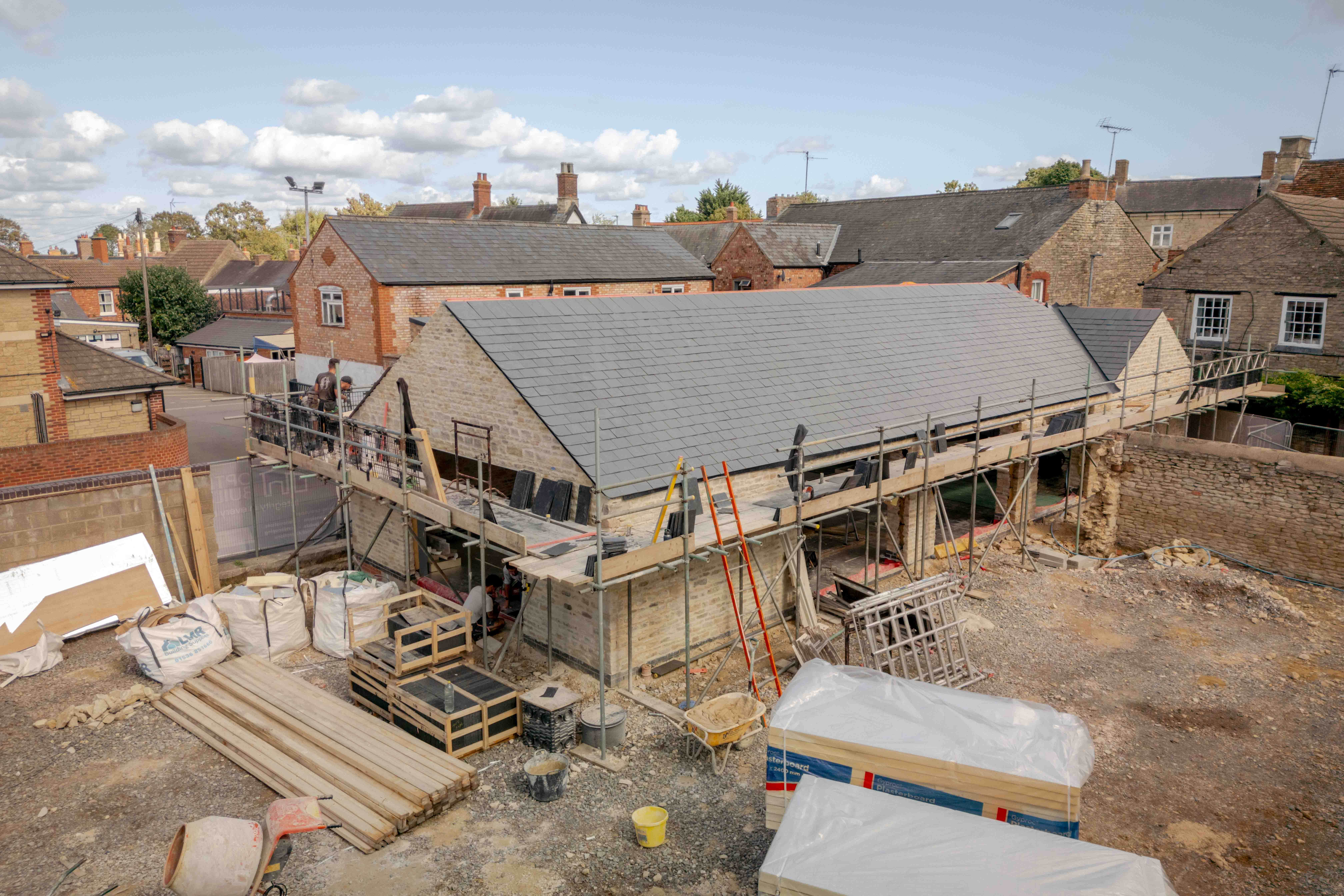 The site and surrounding rooftops from above