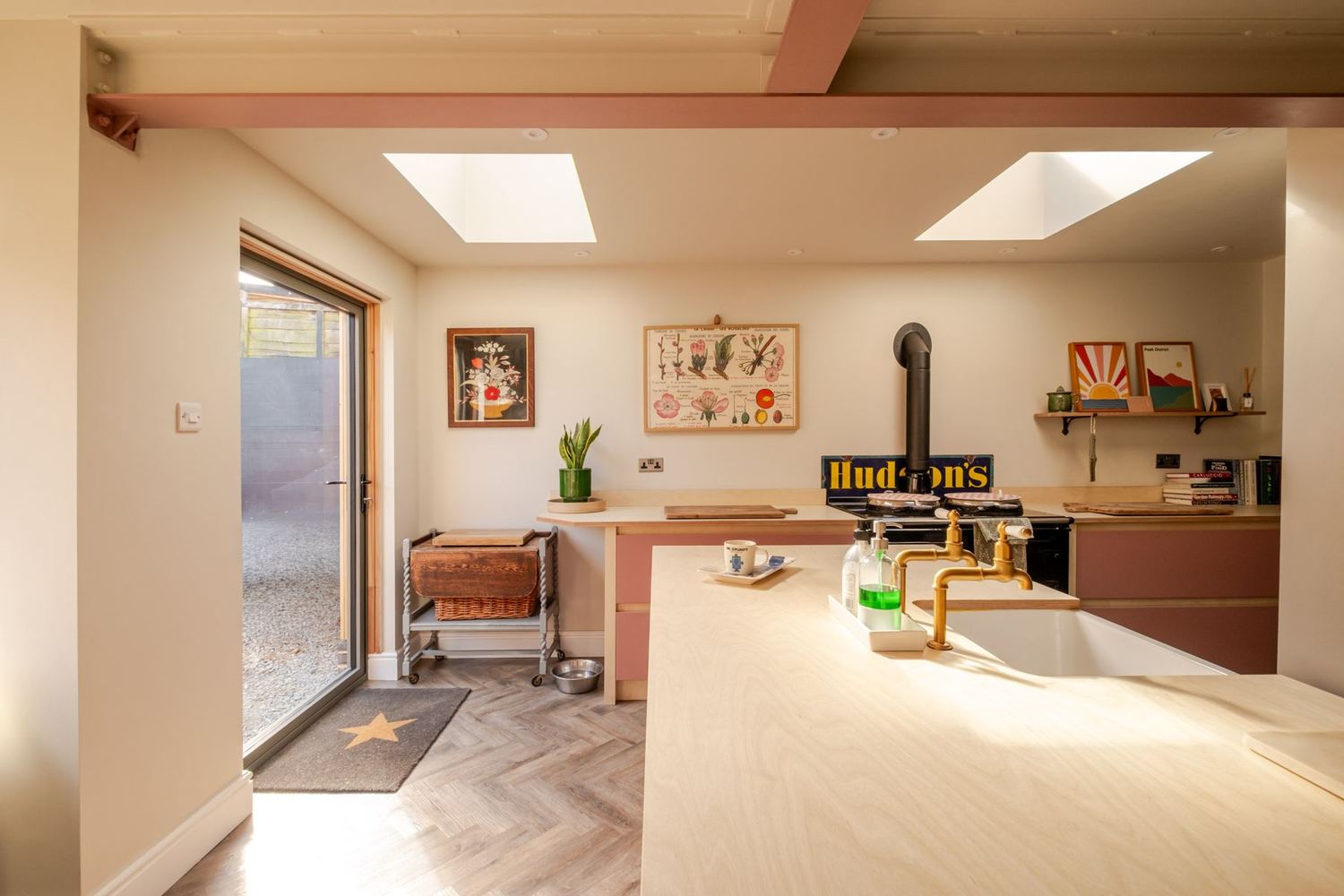 The open-plan kitchen and living space at North End, lit by rooflights and opening to the garden