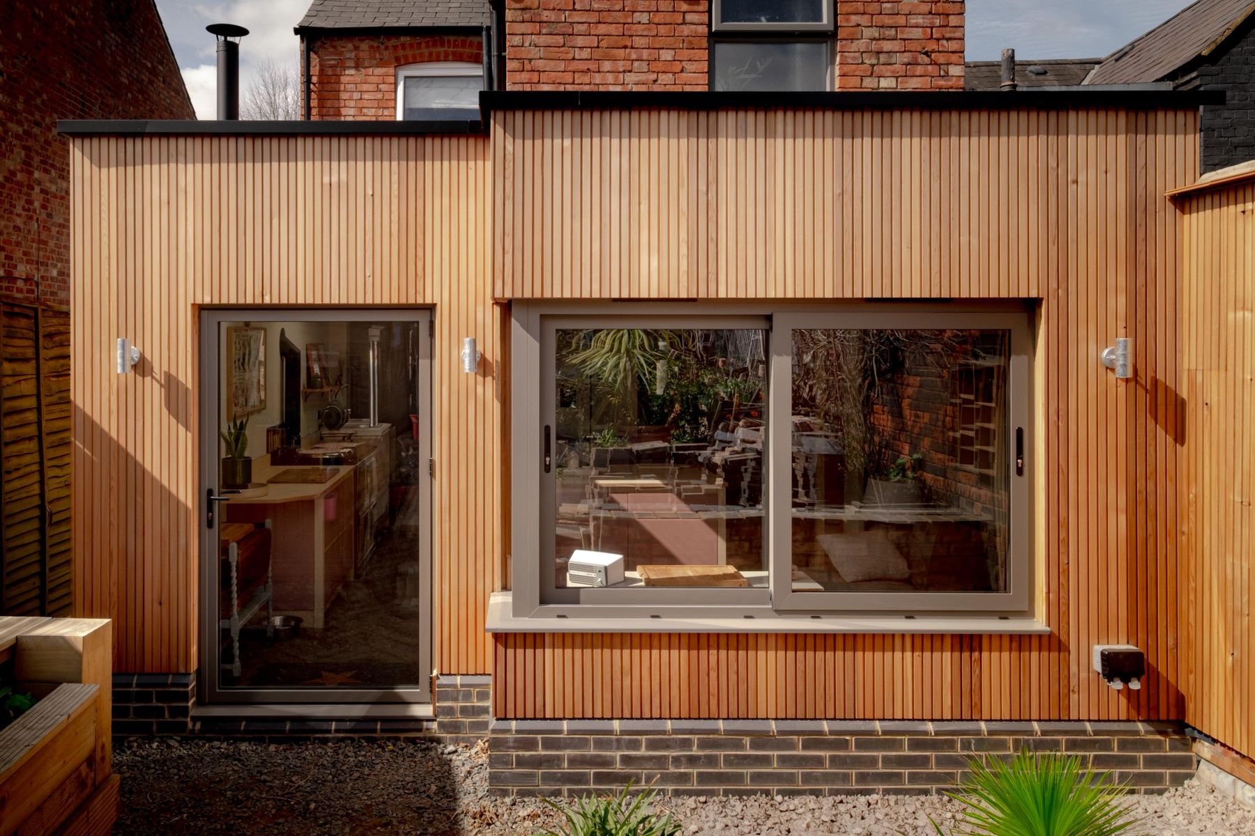 Timber-clad rear extension to an old townhouse