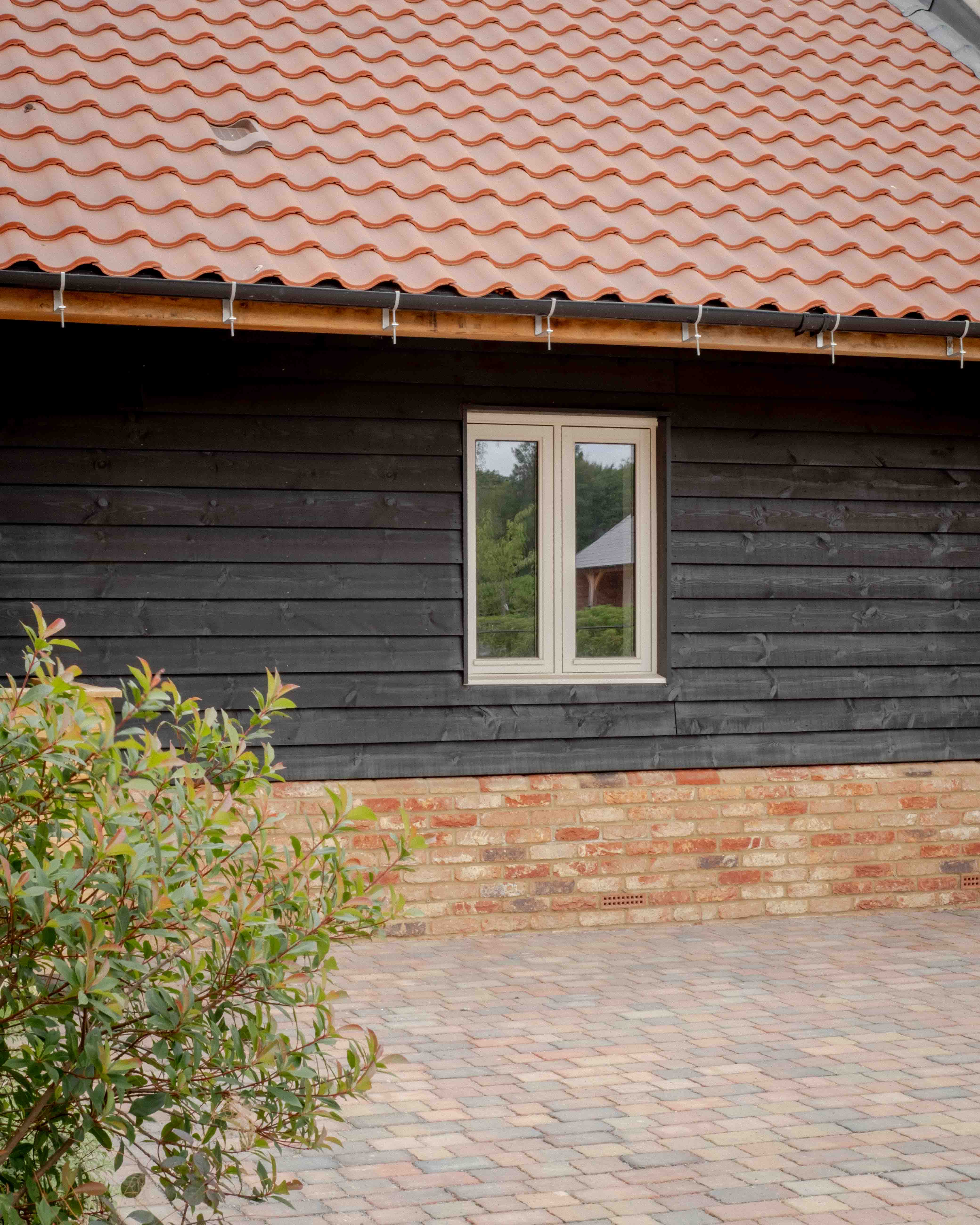 Black timber cladding under the pantiles