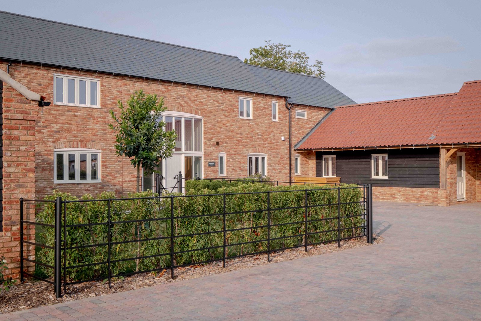Blackberry Barn, with its open oak cart lodge on brick piers
