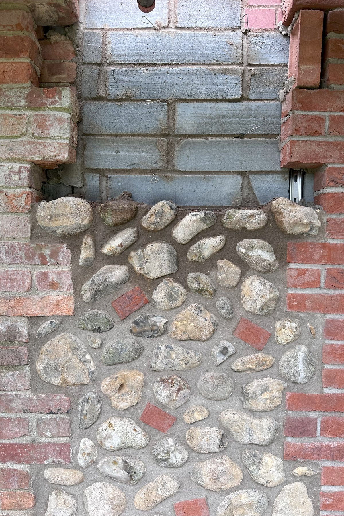 Brick and flint made good around an altered opening