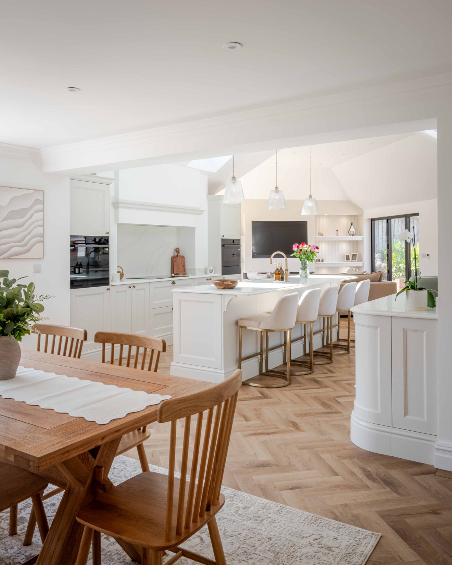 Dining area and island with garden beyond