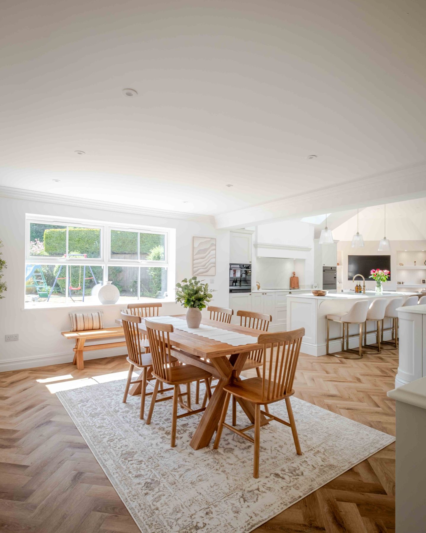 Dining space with window seat and garden view
